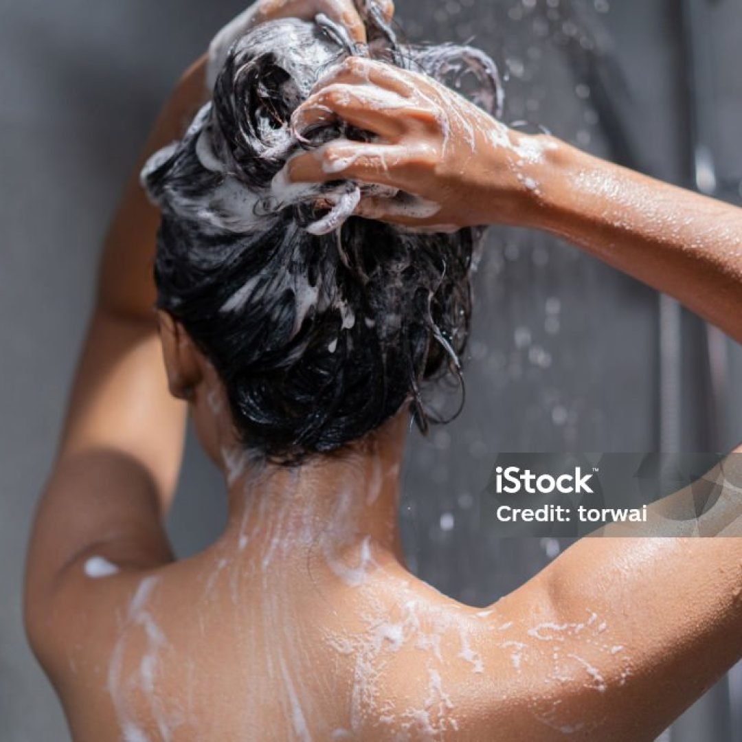 Woman bathing and washing her hair relaxed.